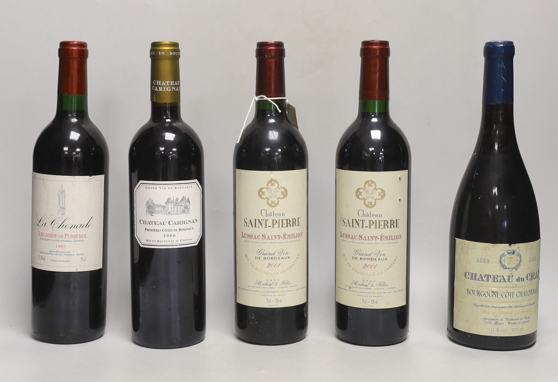 Nine bottles of assorted red wine including three bottles of Lussac Saint Emilion 2001, a bottle Chateauneuf-du-Pape 2009 a bottle of Laplander De Pomerol 1997